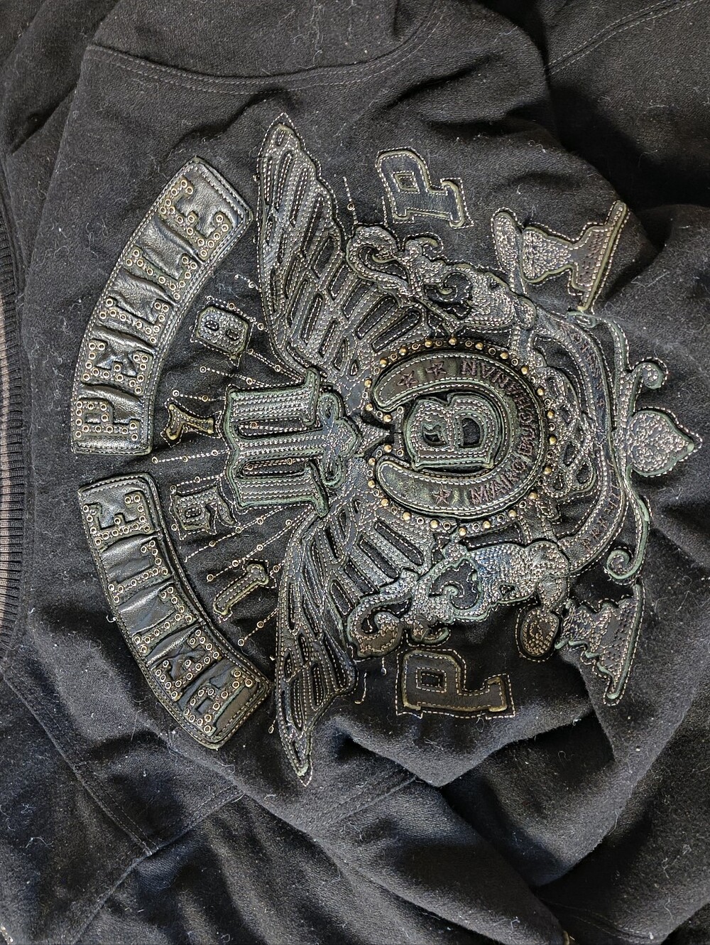Pellepelle Black Jacket with Rhinestone Crest Small Dryer Burn On Inside Lining.
